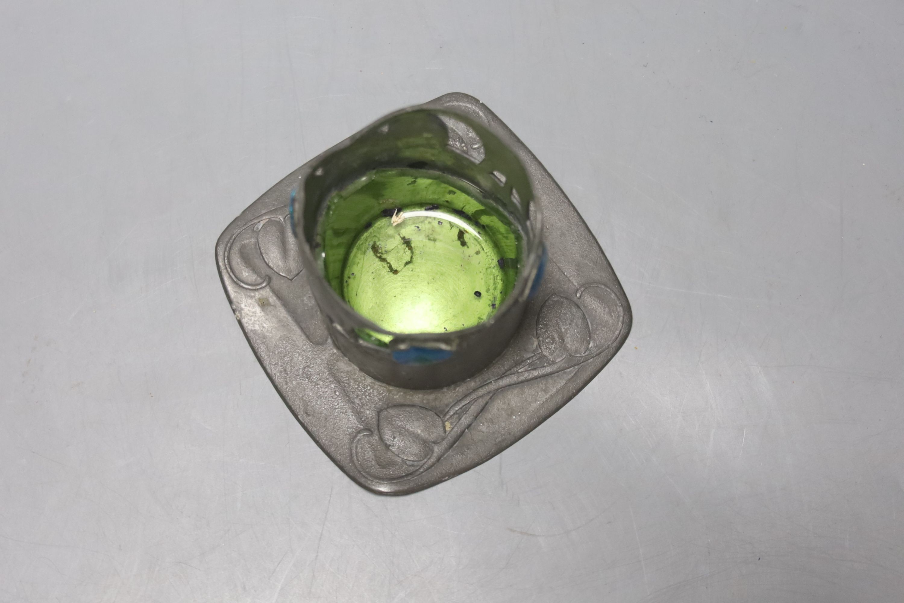 A Libertys Tudric enamelled pewter stand, H7cm, remnants of glass